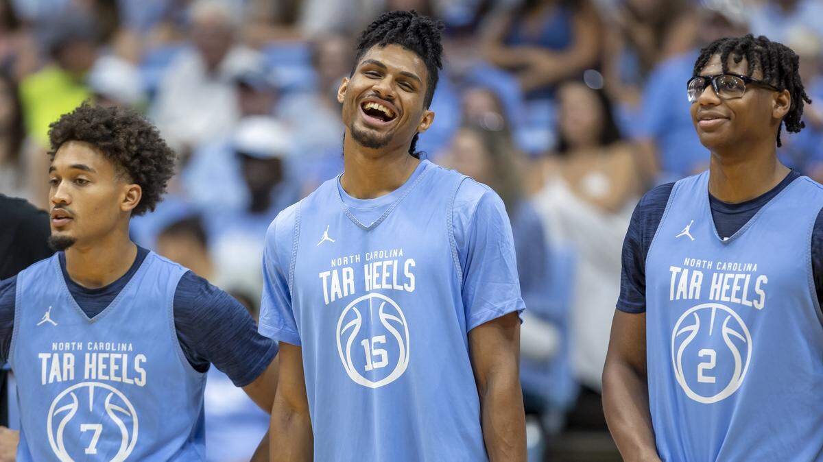 North Carolina forward Jarin Stevenson (15) smiles as he stands with Blue teammates, Zayden High (1), Seth Trimble (7) and James Brown (2), prior to the Tar Heels’  Blue-White scrimmage on Saturday, October 4, 2025 at the Smith Center in Chapel Hill, N.C.