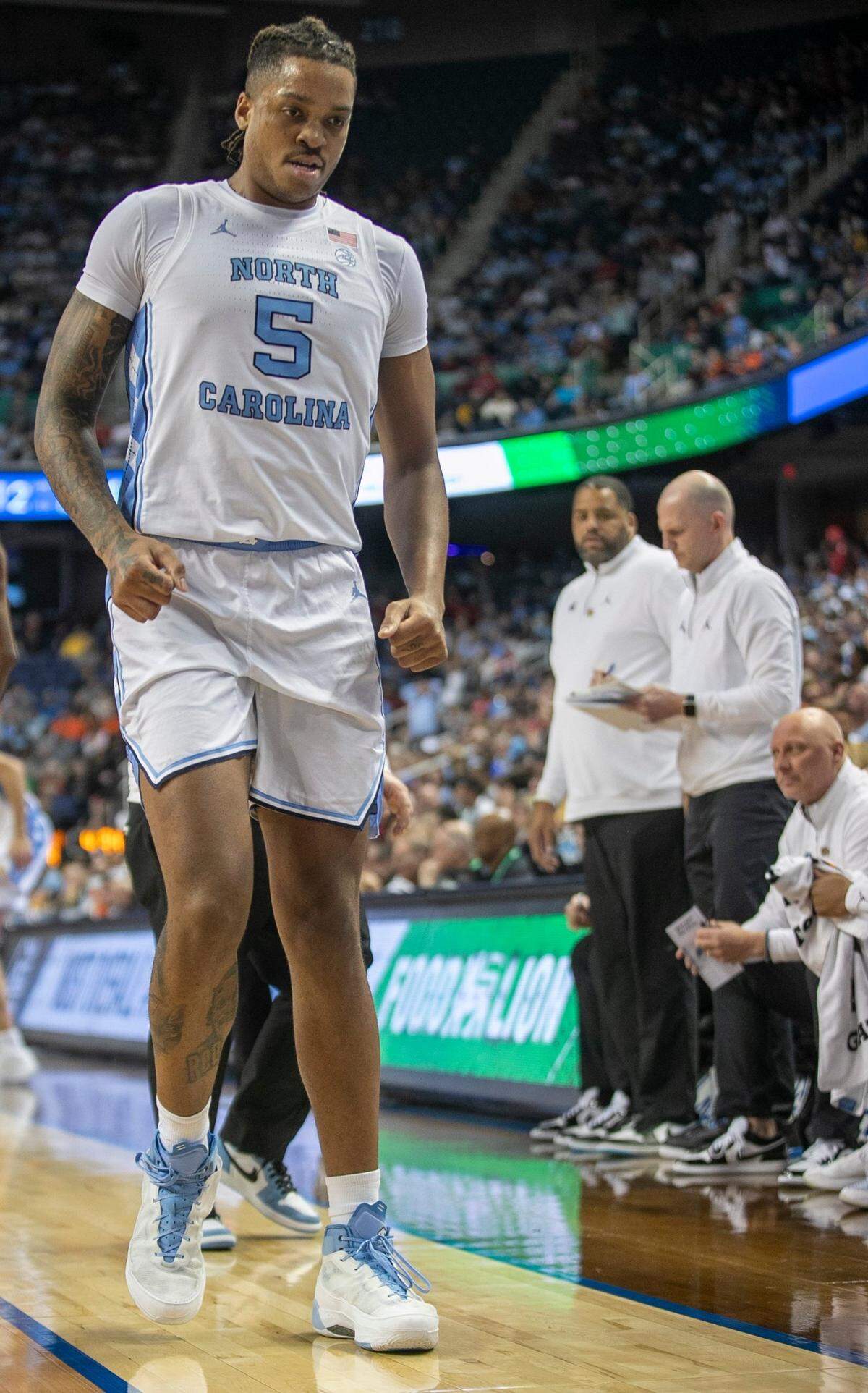 North Carolina’s Armando Bacot (5) leaves the court after injuring himself in the first half against Boston College in the second round of the ACC Tournament on Wednesday, March 8, 2023 at the Greensboro Coliseum in Greensboro, N.C.
