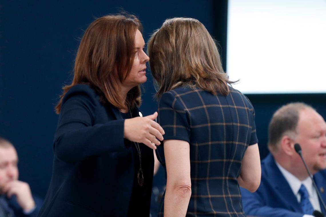 Sen. Vicki Sawyer, left, talks with Sen. Amy Galey before the N.C. Senate Education Committee meeting in Raleigh, N.C., Wednesday, July 21, 2021.