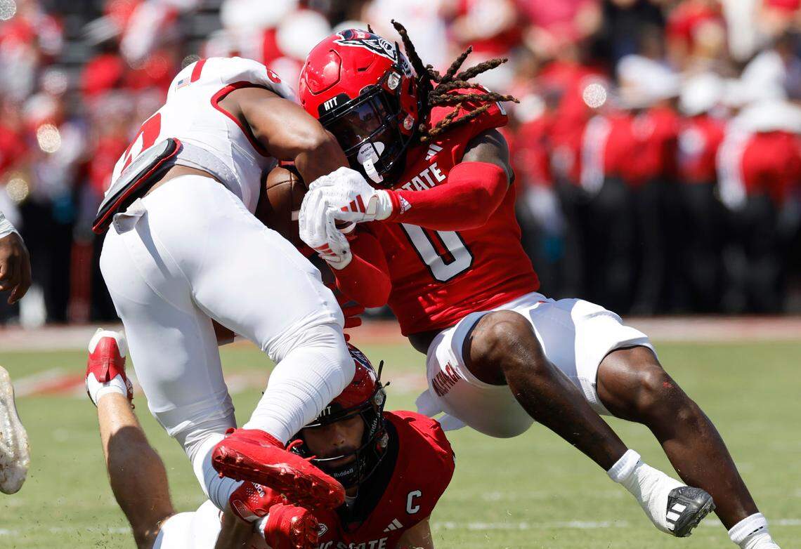 N.C. State safety Sean Brown (0) tackles Virginia Military Institute running back Rashad Raymond (5) during the first half of N.C. State’s game against VMI at Carter-Finley Stadium in Raleigh, N.C., Saturday, Sept. 16, 2023.