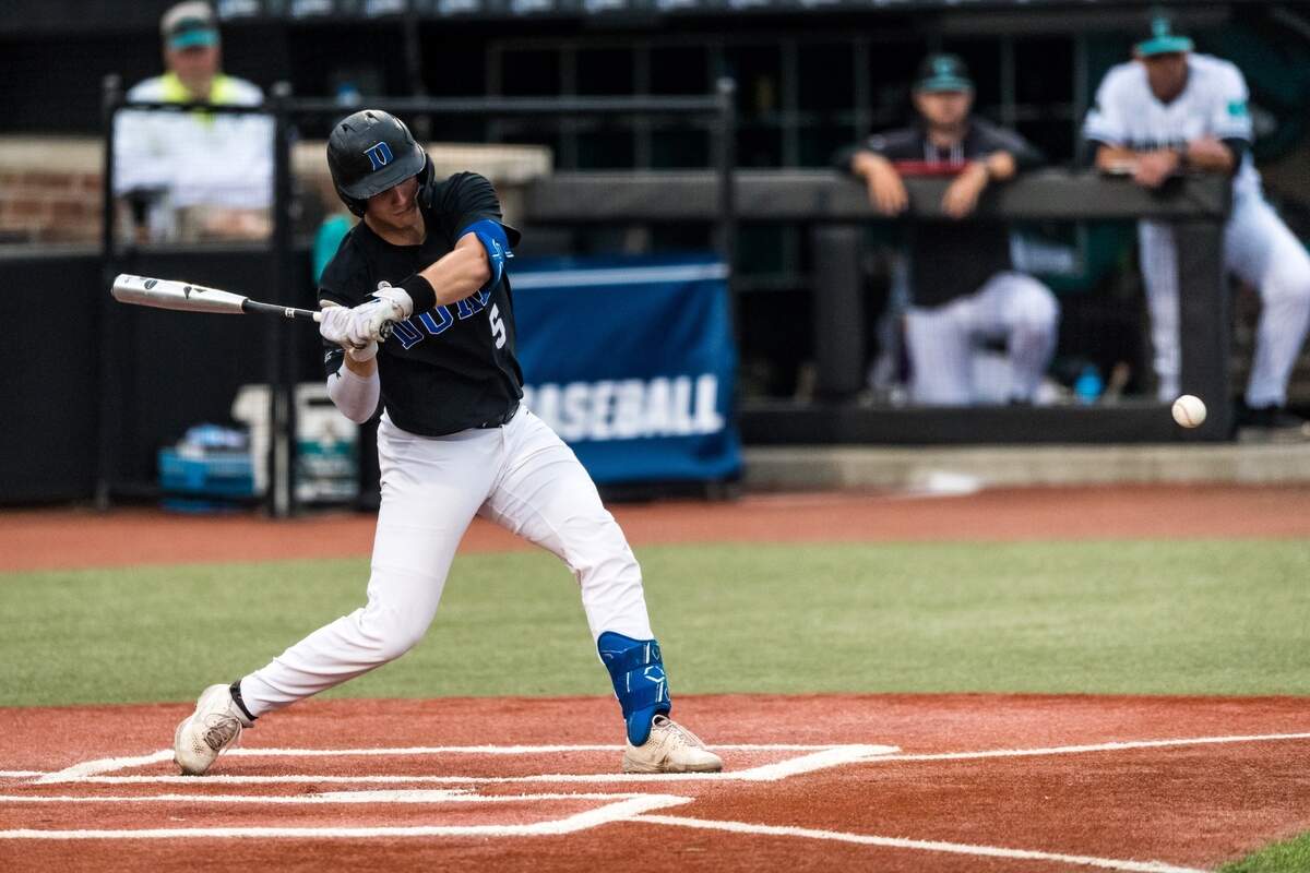 Duke Blue Devils catcher Alex Stone swings the bat during Sunday night’s NCAA Tournament Conway Regional game with Coastal Carolina at Spring Brooks Stadium in Conway, S.C. Stone hit two solo home runs in Duke’s 8-6 loss.