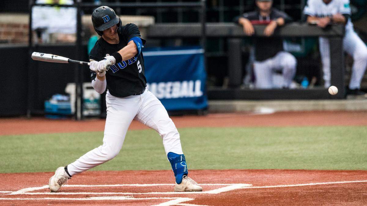 Duke Blue Devils catcher Alex Stone swings the bat during Sunday night’s NCAA Tournament Conway Regional game with Coastal Carolina at Spring Brooks Stadium in Conway, S.C. Stone hit two solo home runs in Duke’s 8-6 loss.