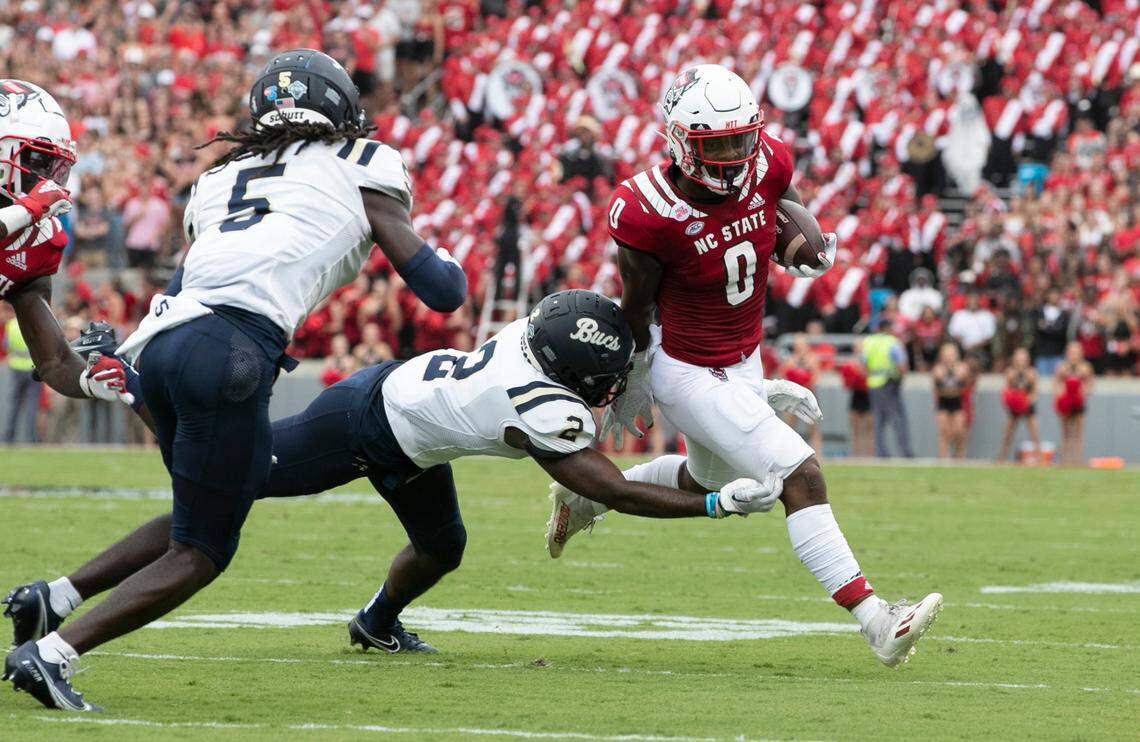 N.C. State running back Demie Sumo-Karngbaye (0) gets around Charleston Southern safety Hombre Kennedy (2) during the first half of N.C. State’s game against Charleston Southern at Carter-Finley Stadium in Raleigh, N.C., Saturday, Sept. 10, 2022.