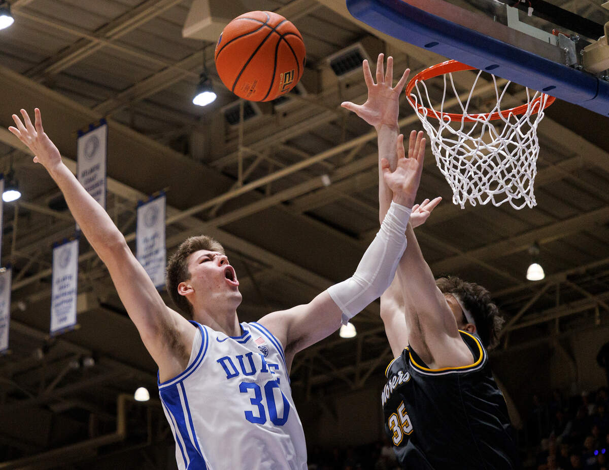 Duke’s Kyle Filipowski is fouled by La Salle’s Rokas Jocius during the first half of the Blue Devils’ 95-66 win on Tuesday, Nov. 21, 2023, at Cameron Indoor Stadium in Durham, N.C.