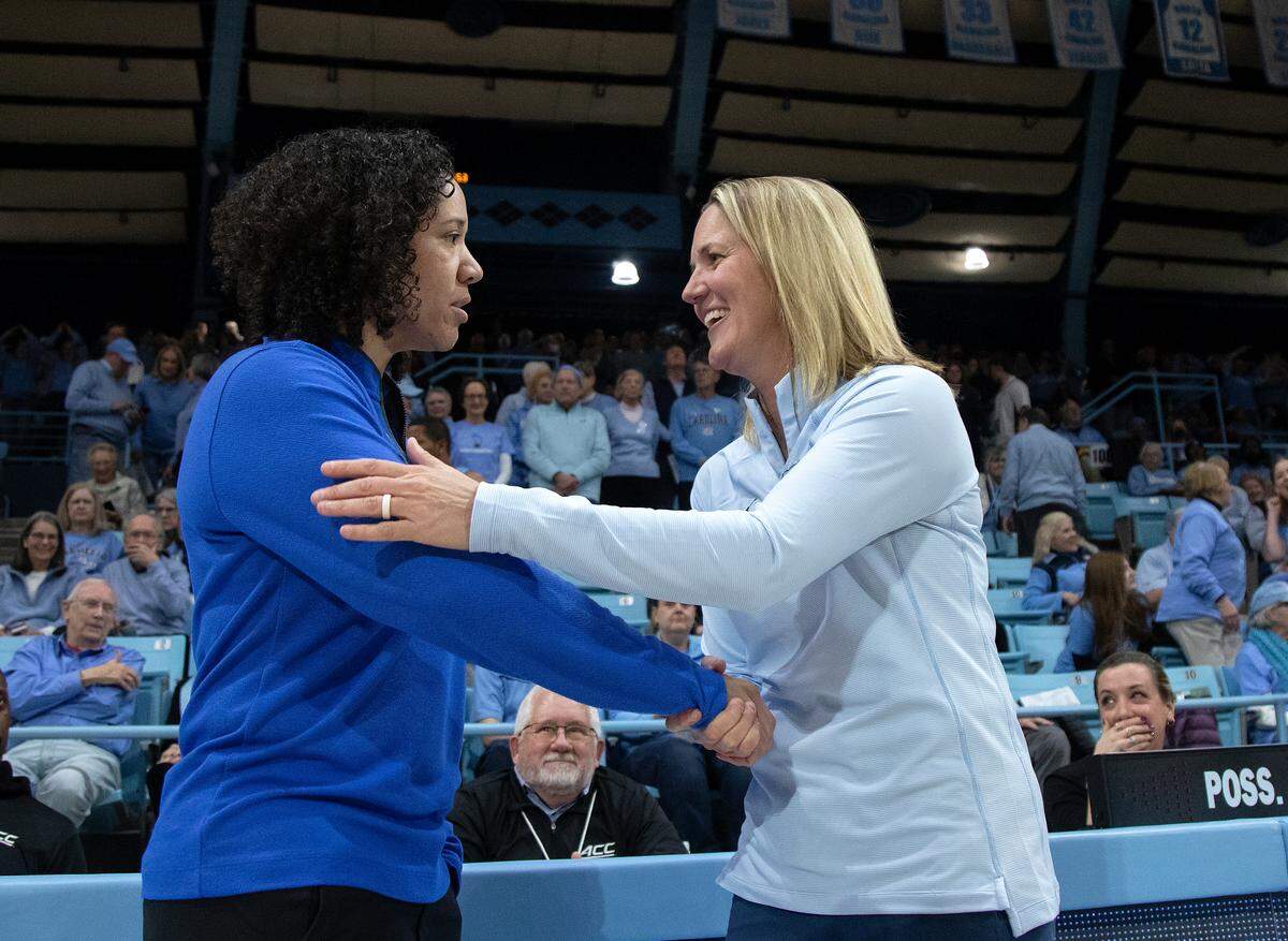 Duke head coach Kara Lawson and North Carolina head coach Courtney Banghart share a word prior to their game on Thursday, Jan. 9, 2025, at Carmichael Arena in Chapel Hill, N.C.