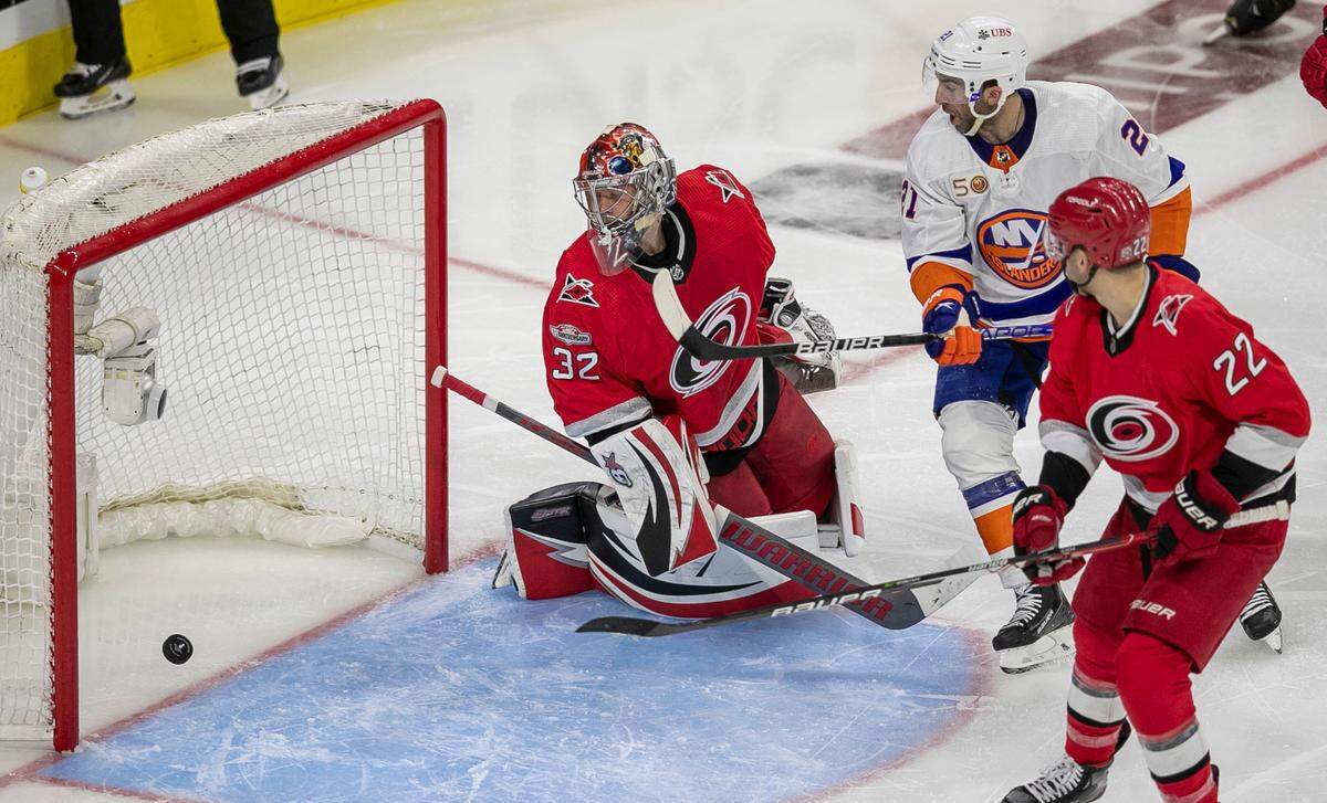 Carolina Hurricanes goalie Antii Raanta (32) lets a shot by New York Islanders’ Ryan Pulock (6) gets past him in the second period on Monday, April 17, 2023 at PNC Arena in Raleigh, N.C.
