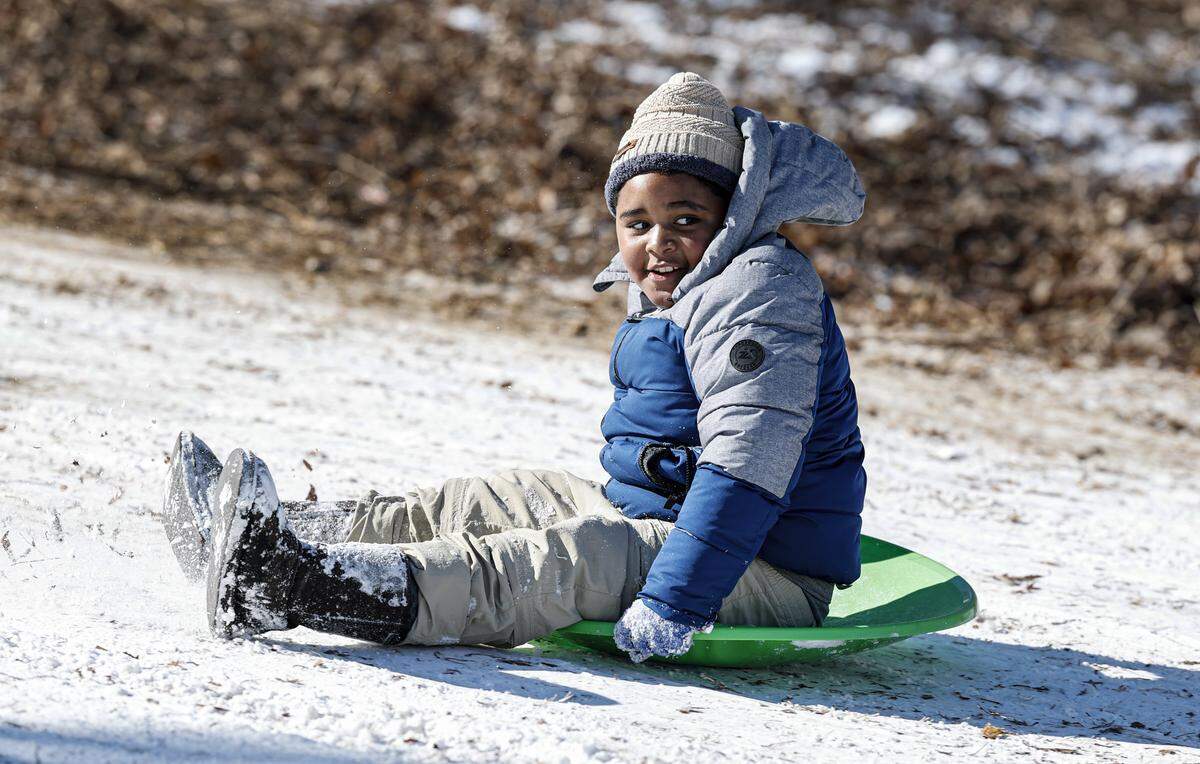 Joshua Feliz, 8, sleds down one of the hills at Dix Park in Raleigh, N.C., Sunday, Feb. 1, 2026.
