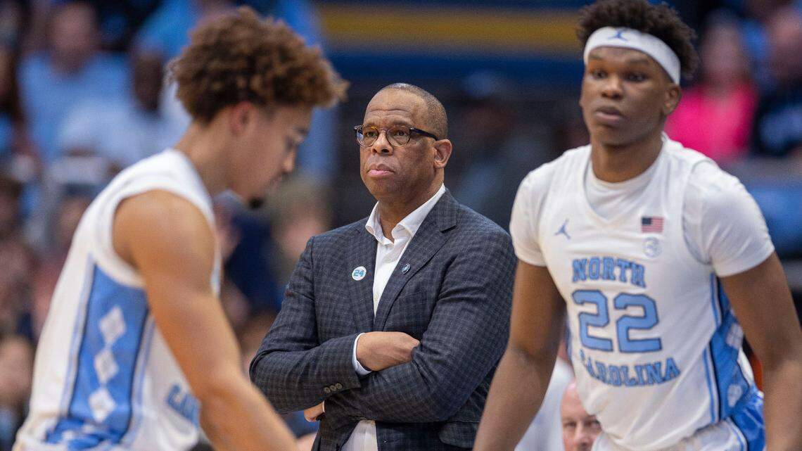 North Carolina coach Hubert Davis watches as Seth Trimble (7), Cade Tyson(5) and Ven-Allen Lubin (22) wait to sub into the game in the first half against Stanford on Saturday, January 18, 2025 at the Smith Center in Chapel Hill, N.C.