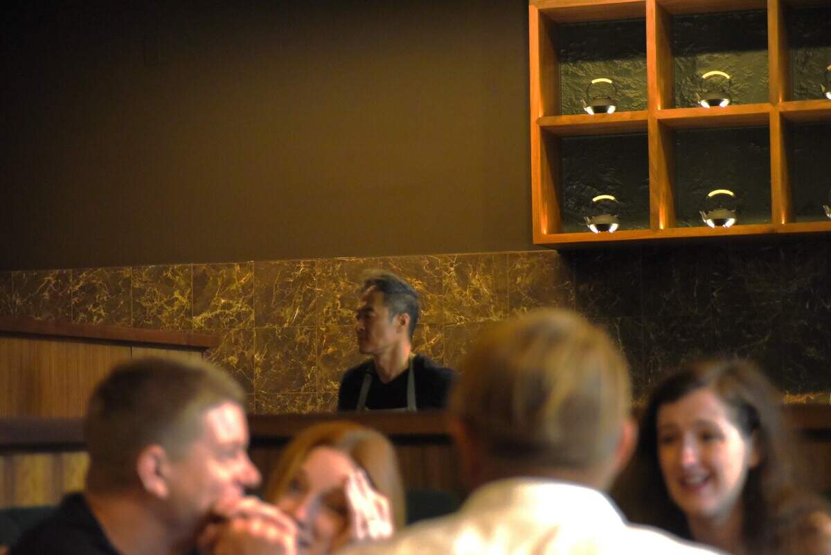 Chef Michael Lee surveys the dining room of his new restaurant M Hansik in Durham.