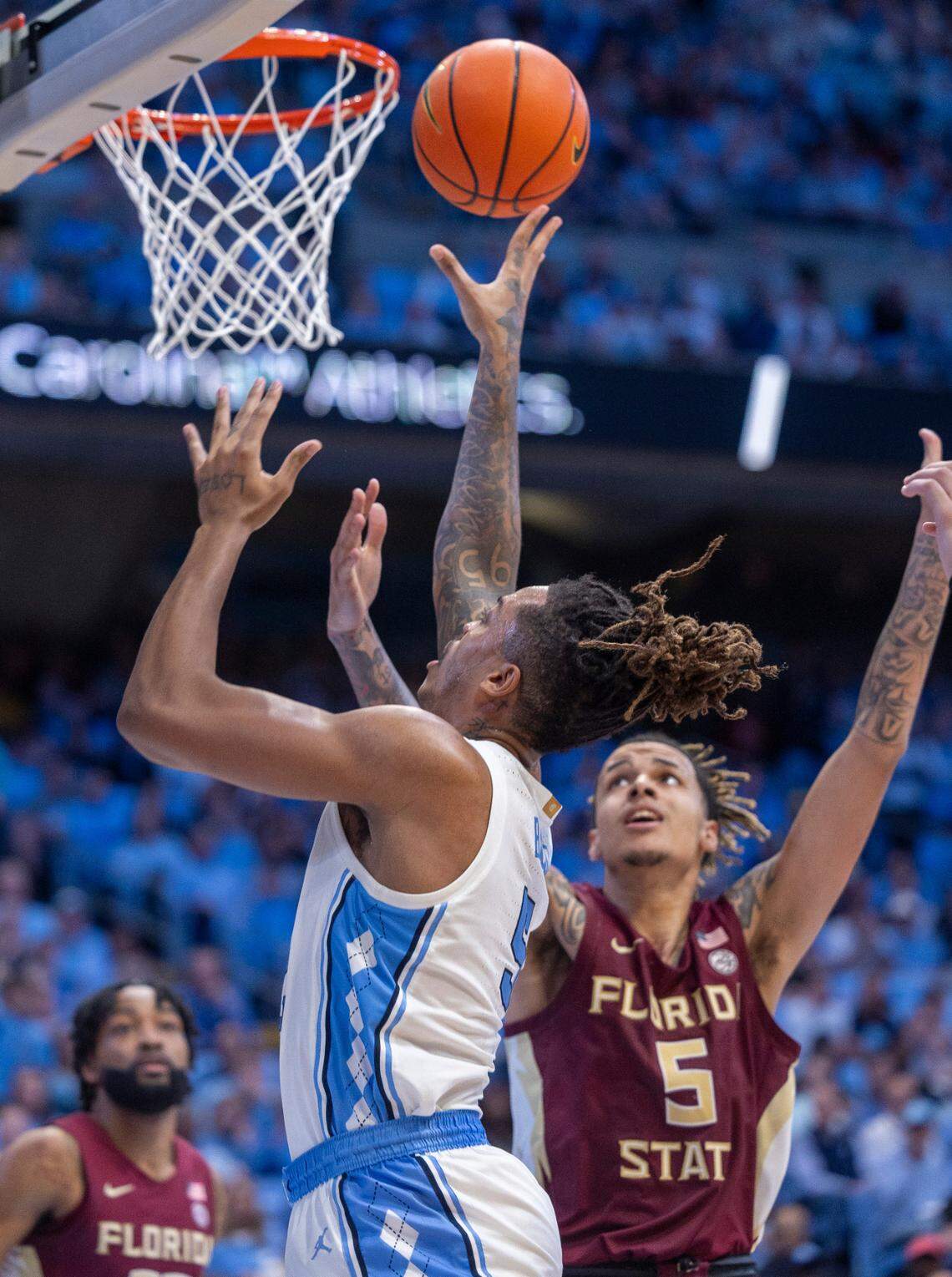 North Carolina’s Armando Bacot (5) puts up a shot against Florida State’s De’Ante Green (5) in the second half on Saturday, December 2, 2023 at the Smith Center in Chapel Hill, N.C.