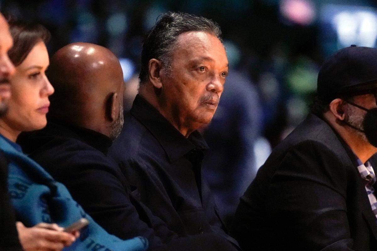Rev. Jesse Jackson watches from courtside during the first half of the HBCU Classic NCAA college basketball game between Morgan State and Howard as part of the NBA All-Star game weekend, Saturday, Feb. 19, 2022, in Cleveland. (AP Photo/Charles Krupa)