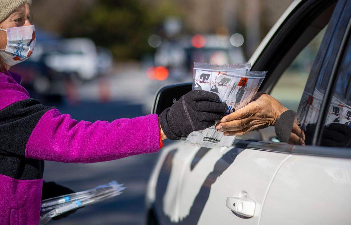 COVID-19 self testing kits are handed out at the Wake County testing site on Kidd Road on Thursday, December 23, 2021 in Raleigh, N.C. Increased demand brought on by the omicron variant and the Christmas holiday, kept a steady flow of people in line throughout the day.