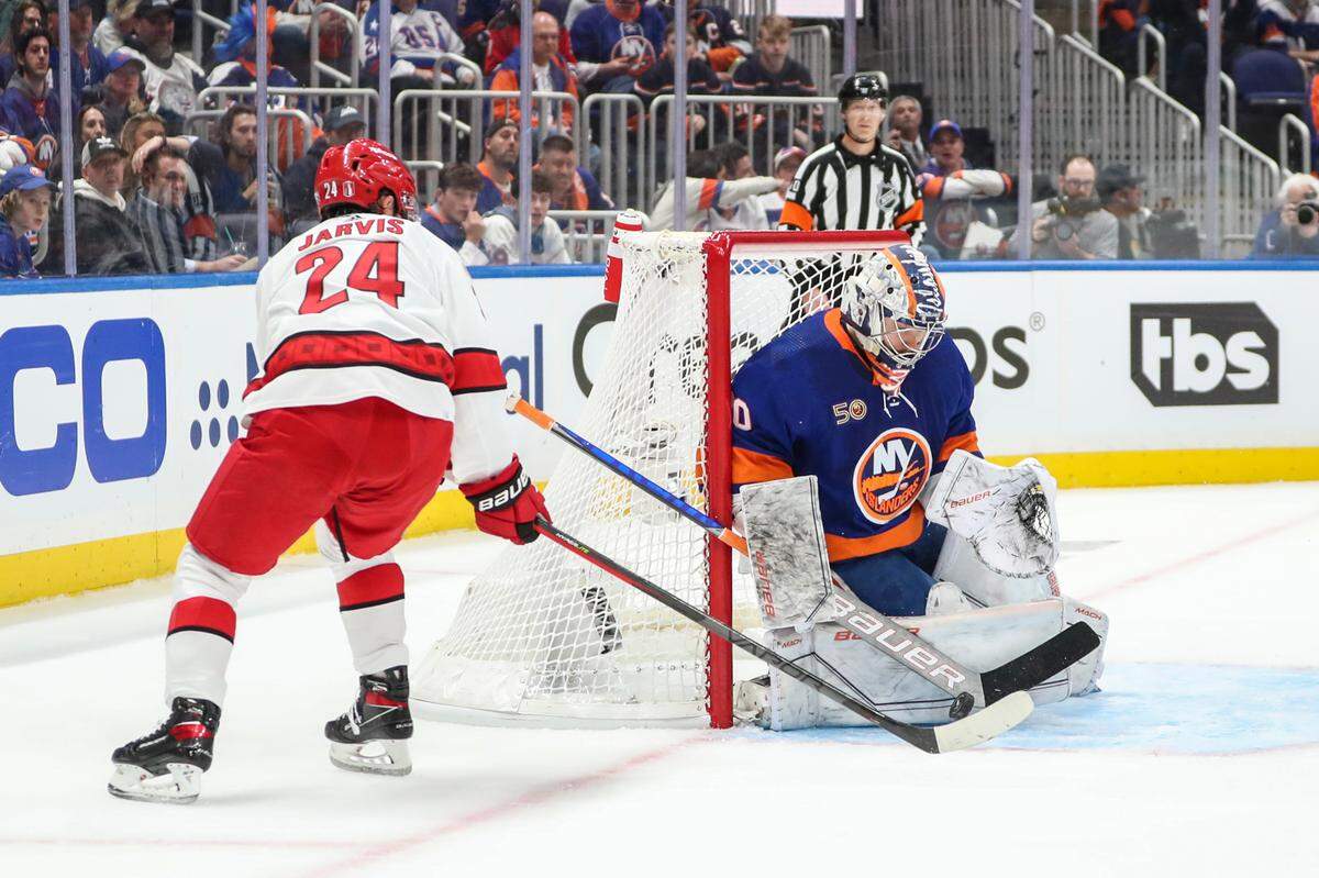 Apr 28, 2023; Elmont, New York, USA; New York Islanders goaltender Ilya Sorokin (30) makes a save against Carolina Hurricanes center Seth Jarvis (24) in game six of the first round of the 2023 Stanley Cup Playoffs at UBS Arena. Mandatory Credit: Wendell Cruz-USA TODAY Sports