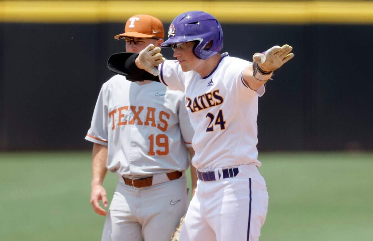 East Carolina’s Ben Newton (24) celebrates after hitting a double in the bottom of the fourth during ECUs game against Texas in the Greenville Super Regional at Clark-LeClair Stadium Friday, June 10, 2022.