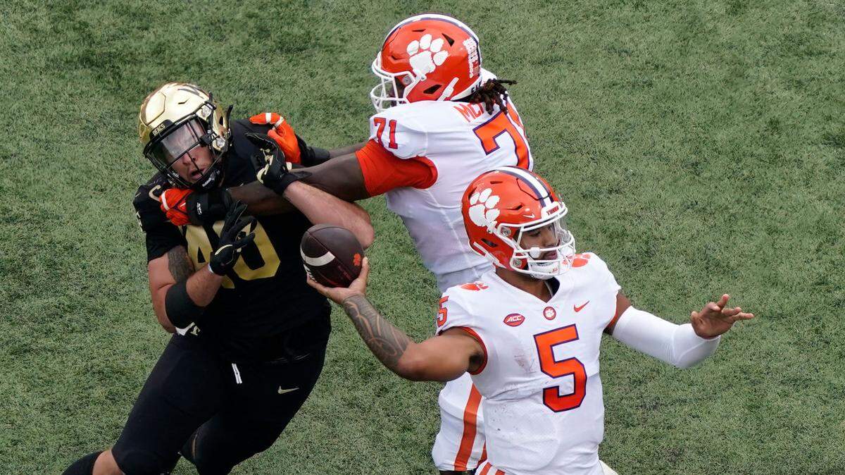 Clemson quarterback DJ Uiagalelei (5) looks to pass against Wake Forest during the first half of an NCAA college football game in Winston-Salem, N.C., Saturday, Sept. 24, 2022. (AP Photo/Chuck Burton)