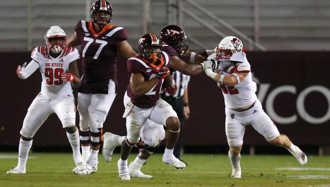 N.C. State linebacker Drake Thomas (32) can’t get to Virginia Tech running back Khalil Herbert (21) during the second half of Virginia Tech’s 45-24 victory over N.C. State at Lane Stadium in Blacksburg, VA Saturday, Sept. 26, 2020.