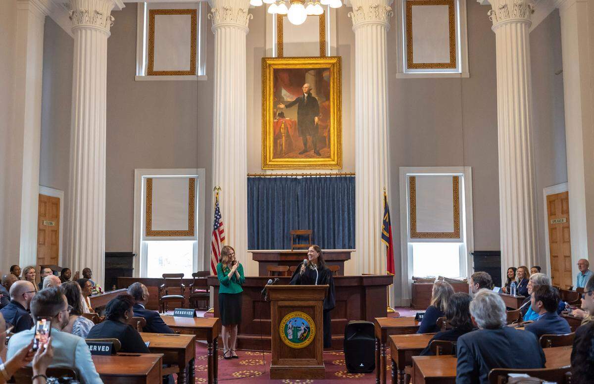 North Carolina Supreme Court Justice Anita Earls introduces Justice Allison Riggs, before administering the oath of office for the North Carolina Supreme Court, in the House Chamber of the State Capitol on Tuesday, May 13, 2025 in Raleigh, N.C.