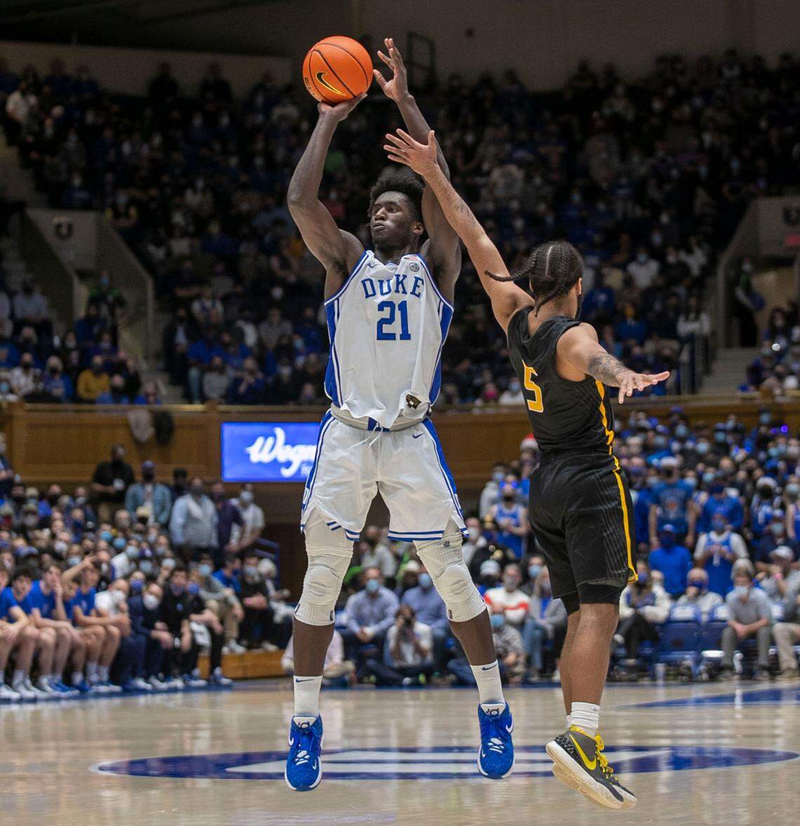 Duke’s A.J. Griffin (21) launches a three-point shot over Appalachian State’s Michael Almonacy (5) during the first half on Wednesday, Thursday 16, 2021 at Cameron Indoor Stadium in Durham, N.