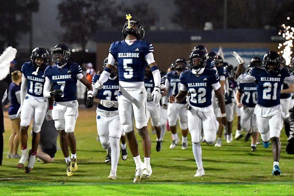 Millbrook wide receiver Taden Martin (5) and his team take to the field before their third-round playoff game with Jordan. The Millbrook Wildcats and the Jordan Falcons met in the third round of the NCHSAA 8A football playoffs in Raleigh, N.C. on November 21, 2025. 