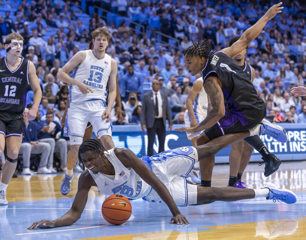 North Carolina forward Caleb Wilson (8) hits the court after colliding with Central Arkansas guard Camren Hunter (1) in the second half on November 3, 2025 at the Smith Center in Chapel Hill, N.C.