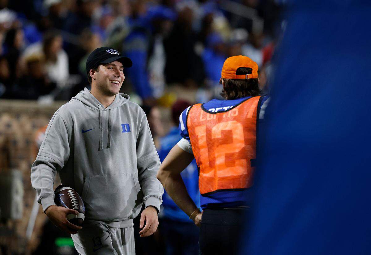 Duke’s Riley Leonard reacts while throwing a football on the sidelines during the second half of the Blue Devils’ 24-3 win over N.C. State on Saturday, Oct. 14, 2023, at Wallace Wade Stadium in Durham, N.C.