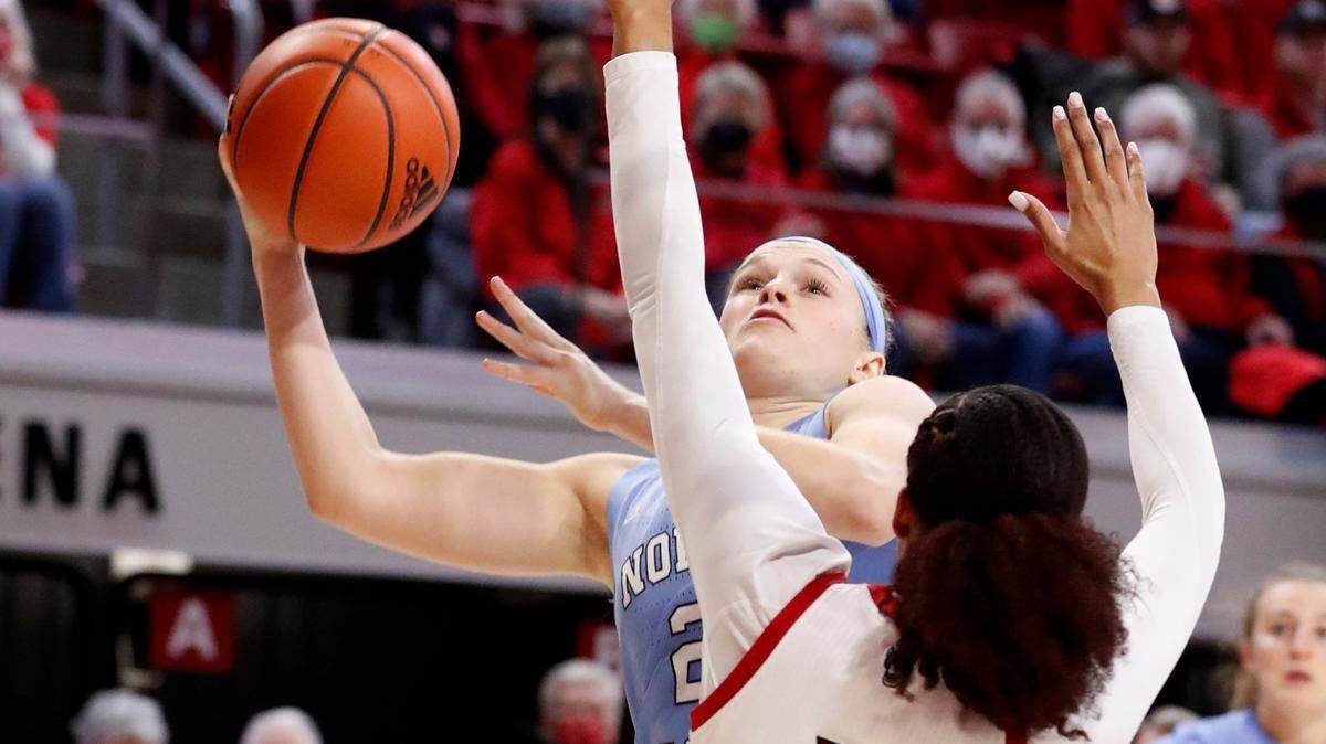 North Carolina’s Carlie Littlefield (2) shoots as N.C. State’s Jakia Brown-Turner (11) defends during the first half of N.C. States game against UNC at Reynolds Coliseum in Raleigh, N.C., on Thursday, January 6.. Littlefield had a solid game against Duke on Thursday, netting nine points, including two 3-pointers.