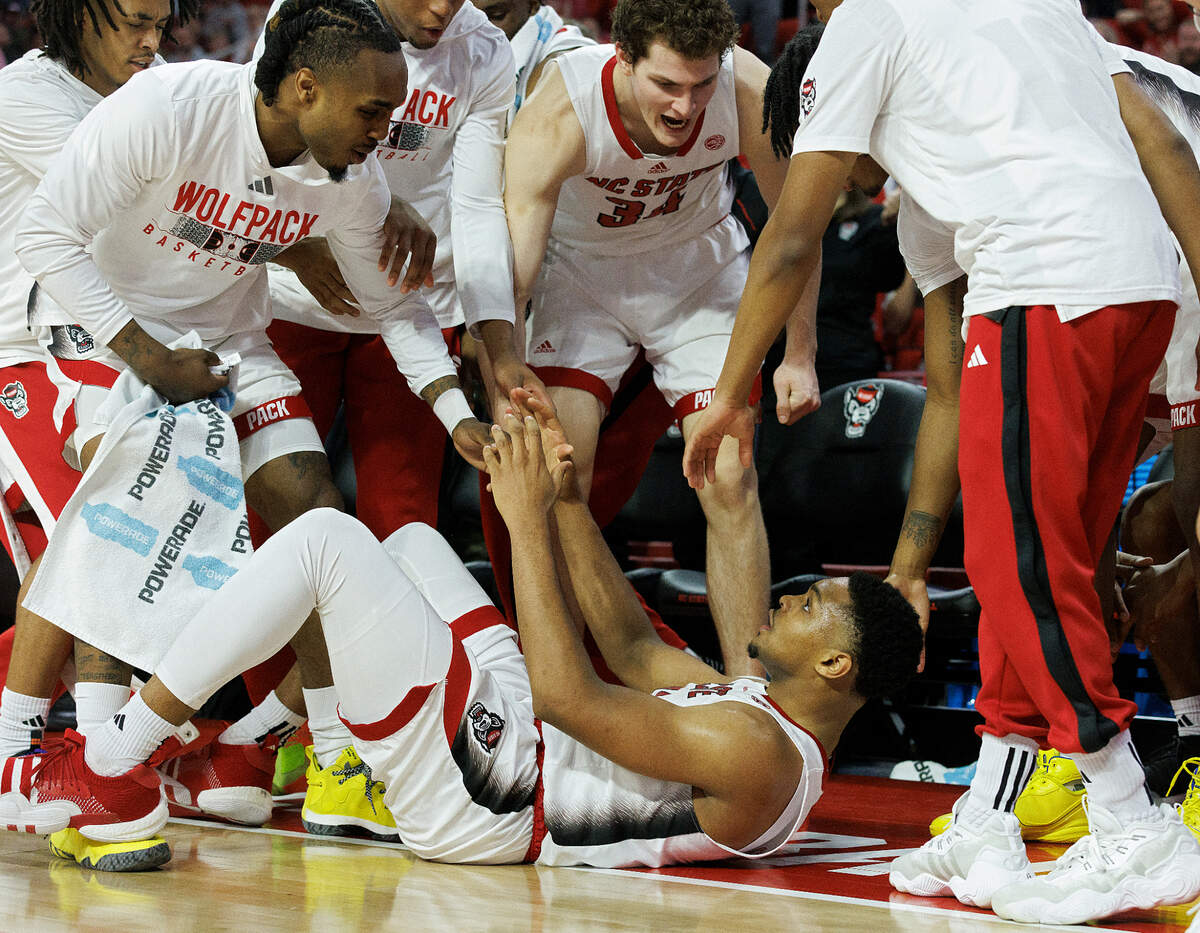 The N.C. State bench reacts after Casey Morsell was fouled on a three-point attempt during the second half of the Wolfpack’s 84-78 loss on Saturday, Jan. 20, 2024, at PNC Arena in Raleigh, N.C.