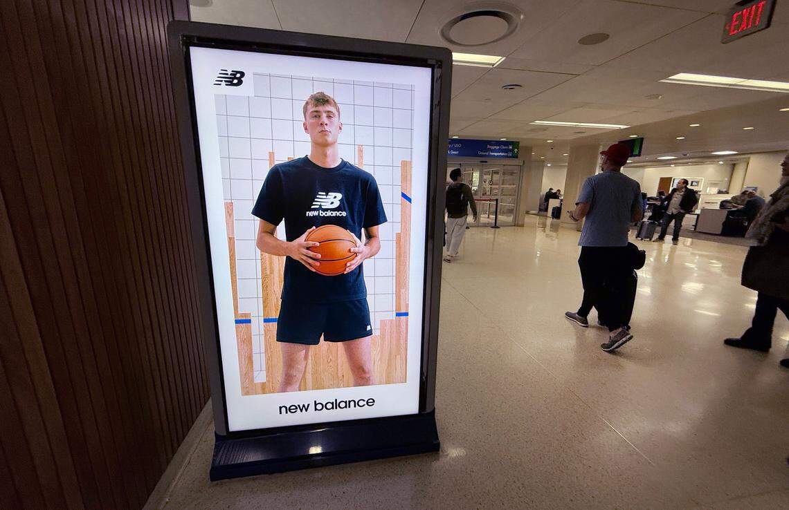 A New Balance ad featuring Cooper Flagg greets travelers at the San Antonio airport, photographed Wednesday, April 2, 2025.