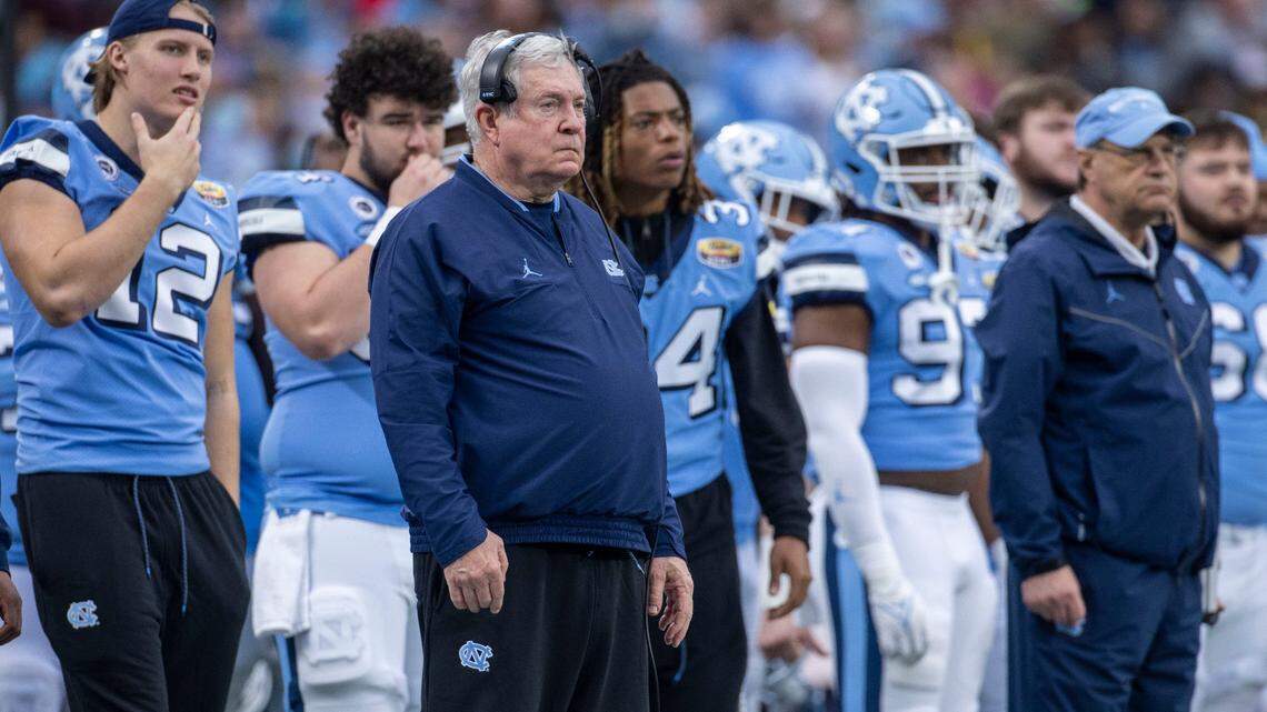 North Carolina coach Mack Brown and the Tar Heels’ bench watch as South Carolina forces the Tar Heels to punt late in the fourth quarter during the Duke’s Mayo Bowl on Thursday, December 30, 2021 at Bank of America Stadium in Charlotte, N.C.