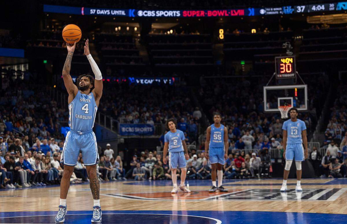 North Carolina’s R.J. Davis (4) shoots free throws after a technical foul on Kentucky coach John Calipari in the first half on Saturday, December 16, 2023 at State Farm Arena in Atlanta, Georgia.