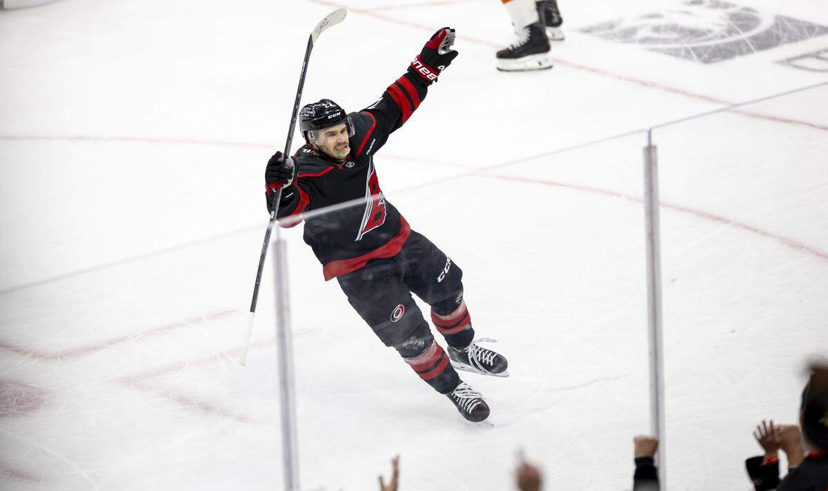 Carolina Hurricanes center Logan Stankoven (22) reacts after scoring to take a 3-0 lead over Philadelphia in the second period of Game 1 on Saturday, May 2, 2026, during the second round of the Stanley Cup Playoffs at Lenovo Center in Raleigh, N.C.