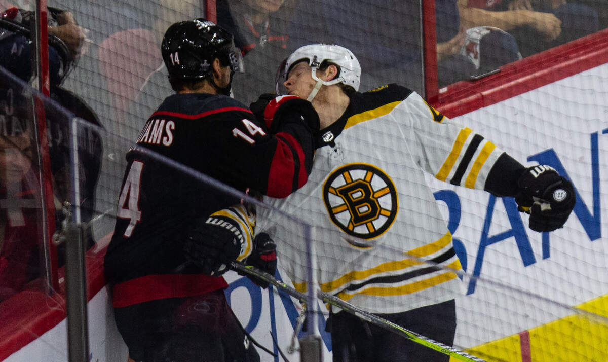 Carolina’s Justin Williams (14) and Boston’s Torey Krug (47) during the first period of Game 3 of the Eastern Conference Finals Tuesday, May 14, 2019 at PNC Arena in Raleigh, NC.