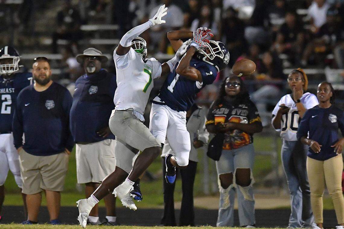 Cardinal Gibbons defensive back Xavier Hasan (7) defends the pass to Southeast Raleigh running back Coby Walker (1) during the second half. The Southeast Raleigh Bulldogs and the Cardinal Gibbons Crusaders met in a non-conference football game in Raleigh, N.C. September 12, 2025