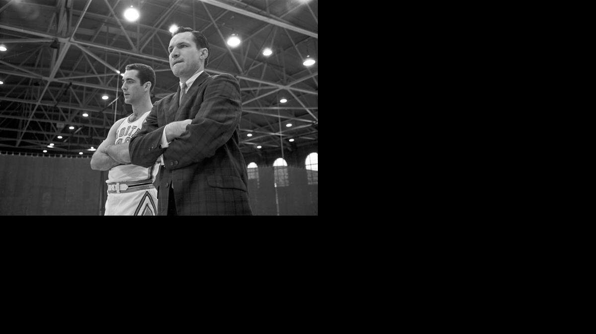 UNC coach Dean Smith, right, in Woollen Gym in 1962. Smith replaced Frank McGuire as head coach in the fall of 1961.
