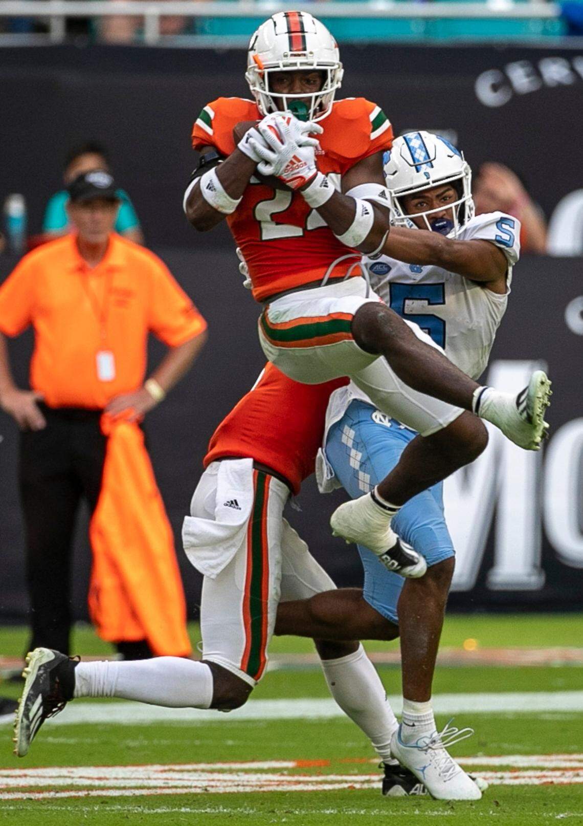Miami’s Kamren Kitchens (24) intercepts a pass by North Carolina quarterback Drake Maye in the third quarter on Saturday, October 8, 2022 at Hard Rock Stadium in Miami Gardens, Florida. This was Maye’s second interception of the game.