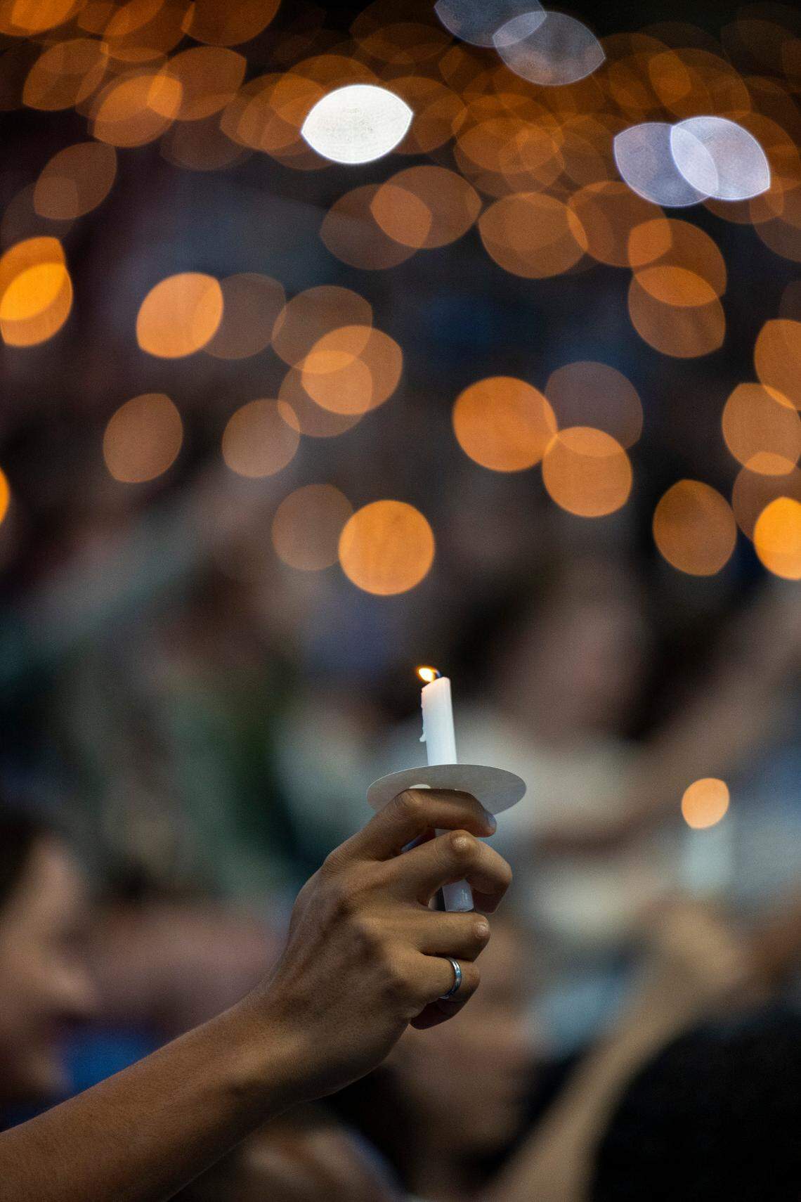 UNC-Chapel Hill students, faculty and family hold a candlelight vigil Friday, Aug 30, 2023 at the Dean Smith Center in honor of professor Zijie Yan who was shot and killed on campus on Monday.