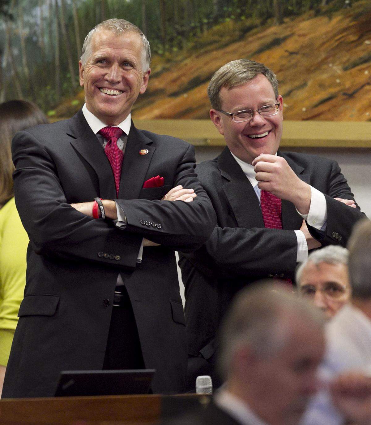 Rep. Tim Moore (right) of Kings Mountain, N.C., the House Rules Chairman chats with Speaker of the House Thom Tillis during debate of Senate Bill 402, the Appropriations Act of 2013 on Wednesday July 24, 2013 at the North Carolina General Assembly in Raleigh, N.C.