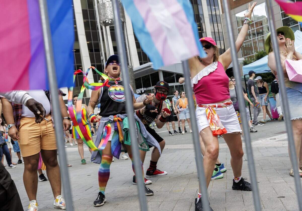 Sandra Herrera Sandy and Deb Good (center left and right) danced near the stage on Fayetteville Street.