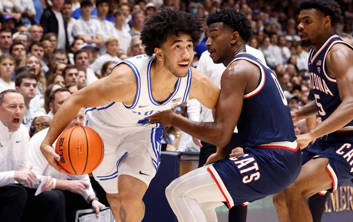 Duke’s Jared McCain (0) drives around Arizona’s Jaden Bradley (0) during the first half of Duke’s game against Arizona at Cameron Indoor Stadium in Durham, N.C., Friday, Nov. 10, 2023.