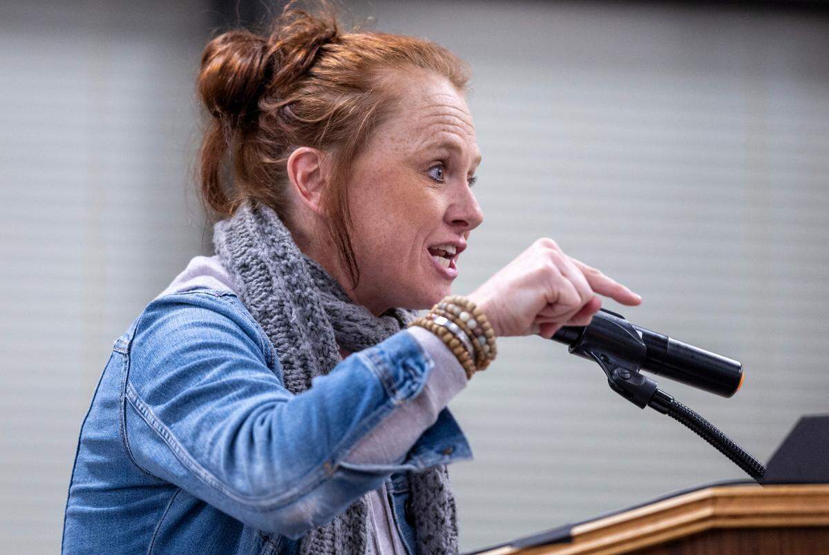Katie McGonnell, a first grade teacher at Little River School addresses the Durham Public Schools Board of Education meeting about her pay on Thursday, February 8, 2024 at the Staff Development Center in Durham, N.C.