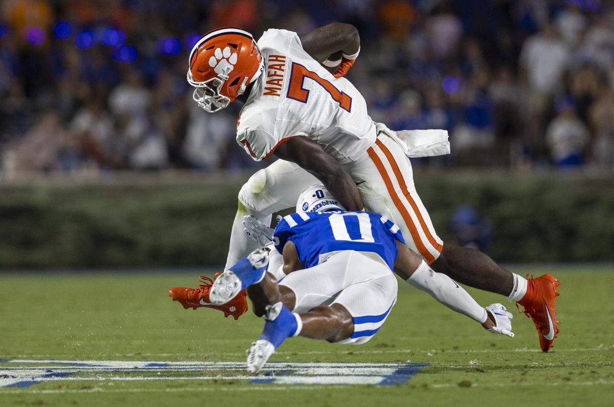Duke’s Chandler Rivers (0) stops Clemson’s Phil Mafah (1) in the first quarter on Monday, September 4, 2023 at Wallace Wade Stadium Stadium in Durham, N.C.