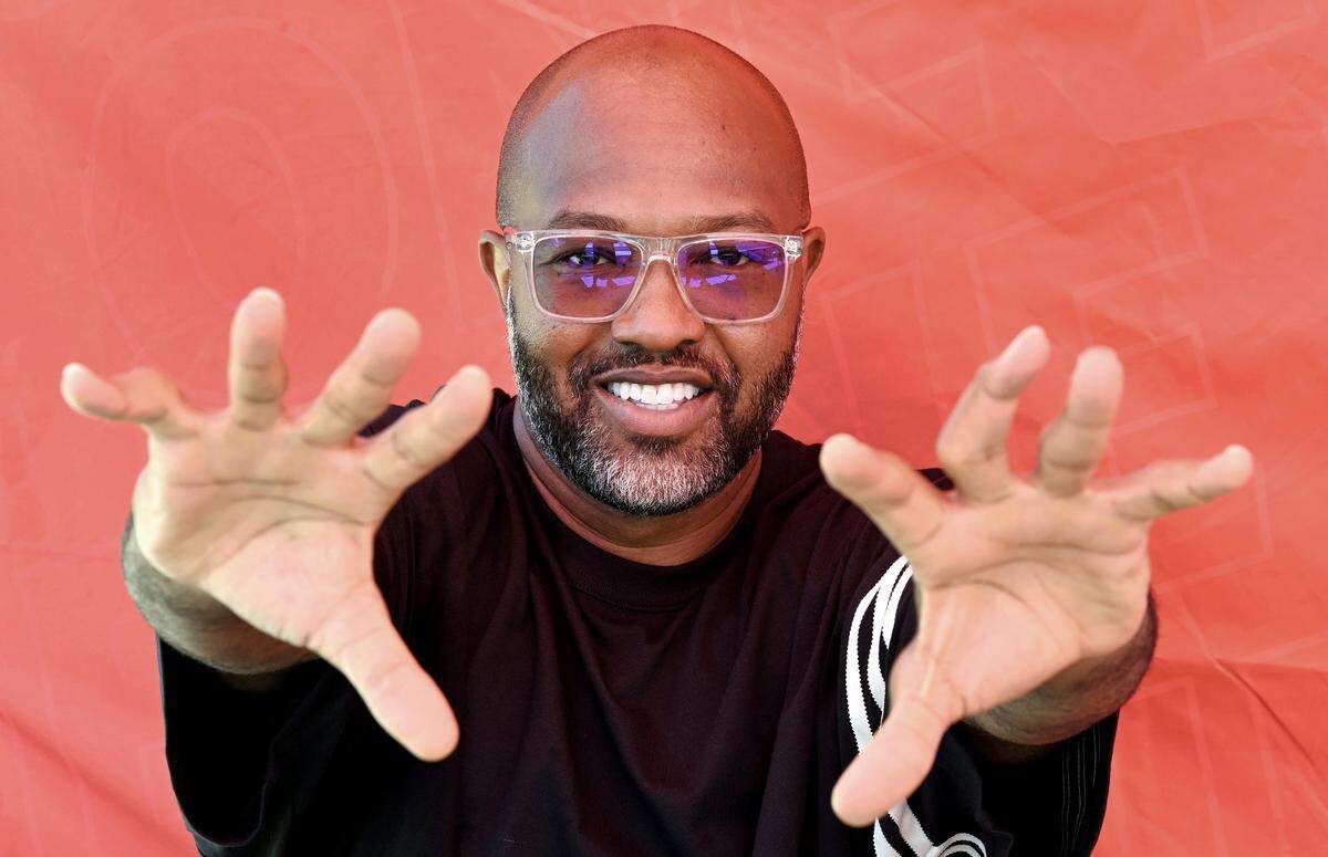 Former NC State Wolfpack and NFL wide receiver Torry Holt poses for a photo in 2023.