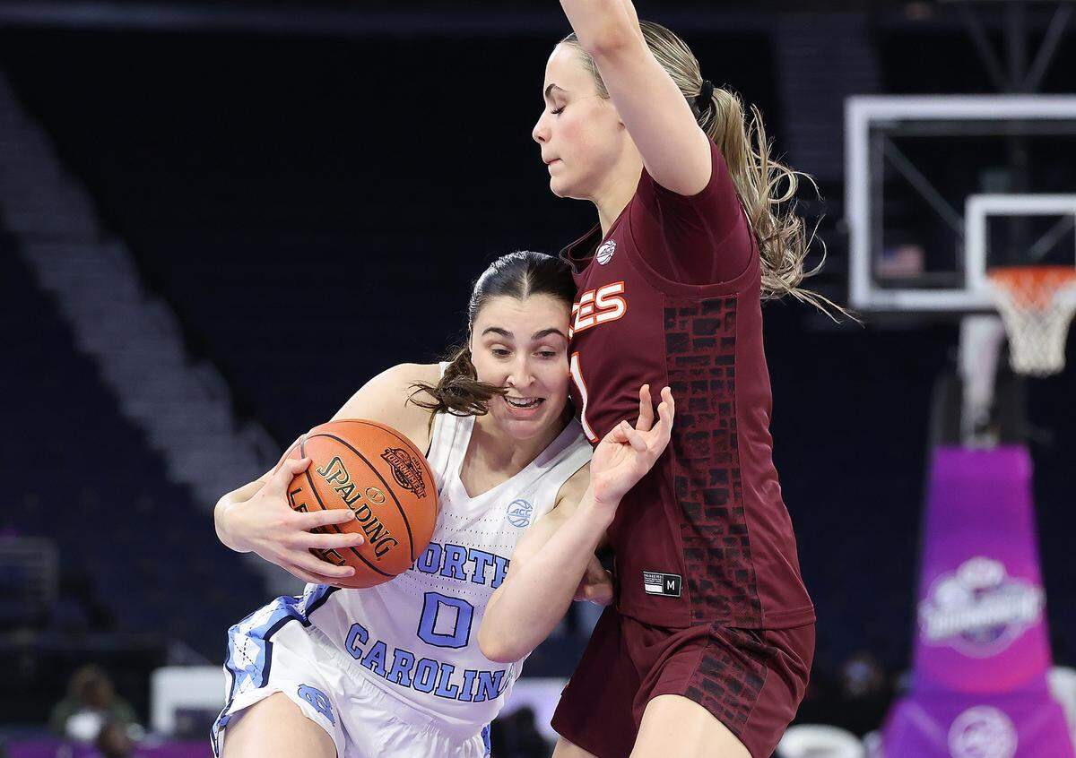 Lanie Grant (0) of the North Carolina Tar Heels drives against Carleigh Wenzel of the Virginia Tech Hokies during the first quarter of the teams’ Women’s ACC Tournament quarterfinal at Gas South Arena on March 6, 2026 in Duluth, Georgia.