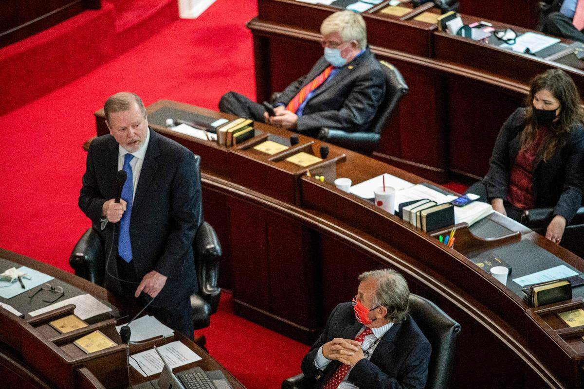 Senate Leader Phil Berger, left, speaks on the Senate floor Monday, March 1, 2021 at North Carolina General Assembly before a failed veto override vote on SB 37, the schools reopening bill Gov. Cooper vetoed. Some North Carolina schools have been remote-only for nearly a year.