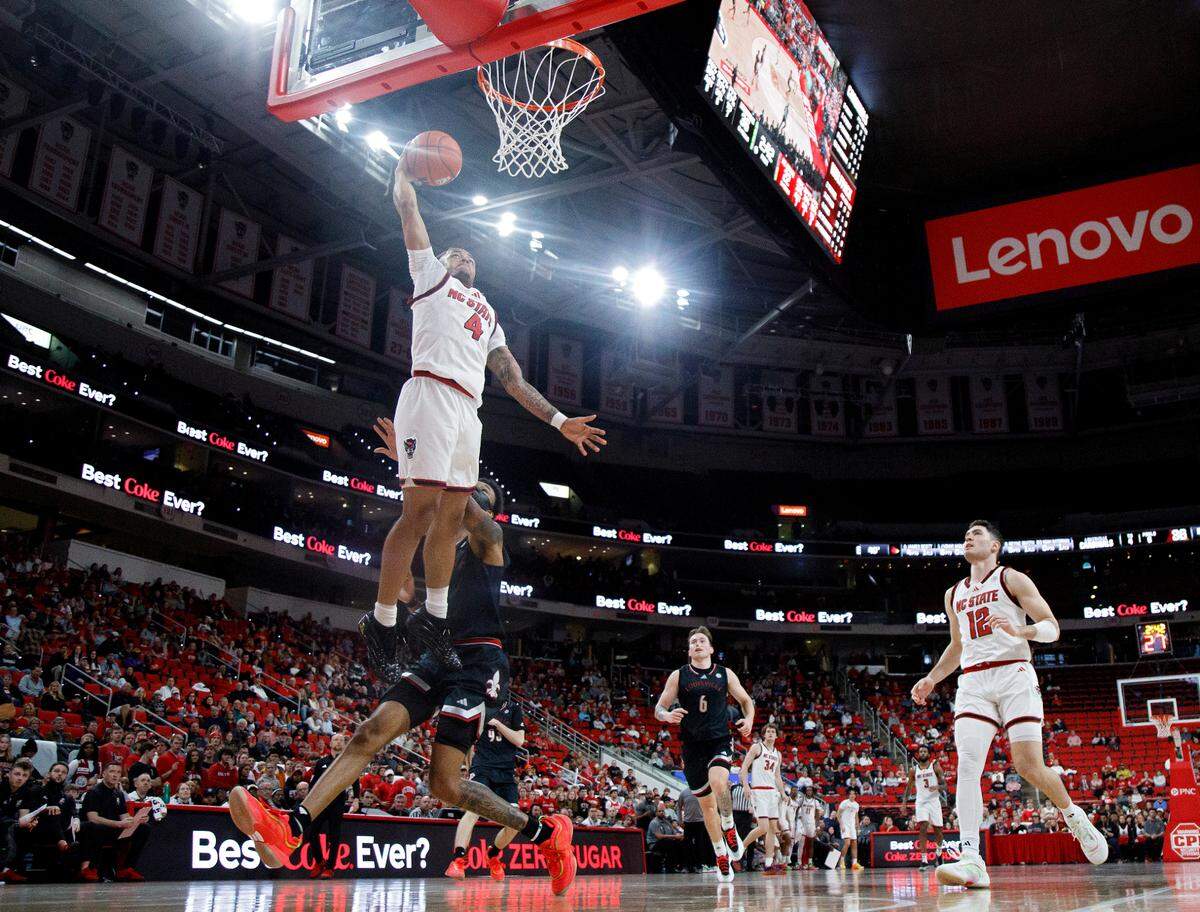 N.C. State’s Breon Pass goes up for a dunk during the first half of the Wolfpack’s 91-66 loss to Louisville on Wednesday, Feb. 12, 2025, at Lenovo Center in Raleigh, N.C.