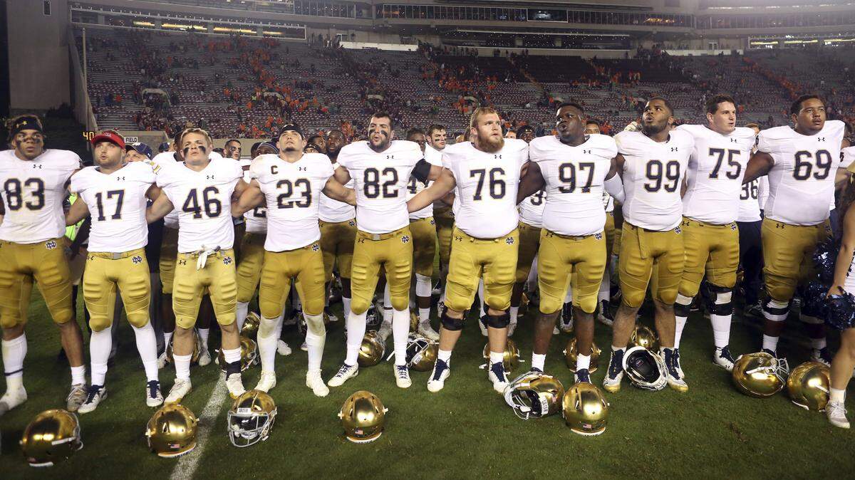 Notre Dame players celebrate after defeating Virginia Tech 45-23 during an NCAA college football game in Blacksburg, Va., Saturday, Oct. 6, 2018. 