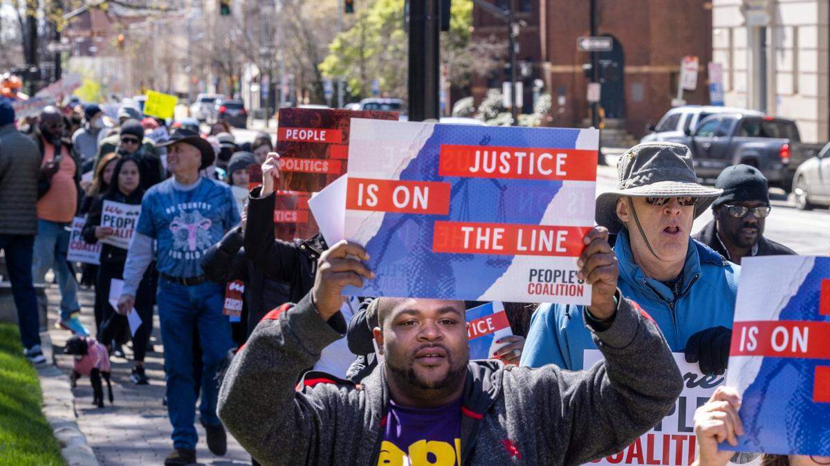 As the N.C. Supreme Court revisited the question of whether partisan gerrymandering was forbidden under the state constitution, voting rights activists marched from the state Capitol in Raleigh to the Legislative Building on March 14, 2022.