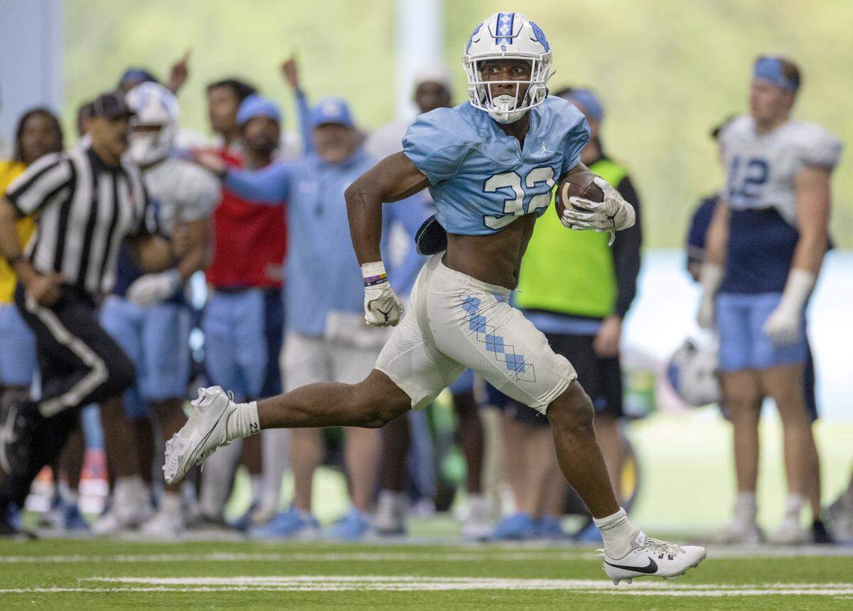 North Carolina’s Major Byrd (32) races to the end zone for a touchdown during the Tar Heels’ scrimmage on Thursday, April 11, 2024 in Chapel Hill, N.C.