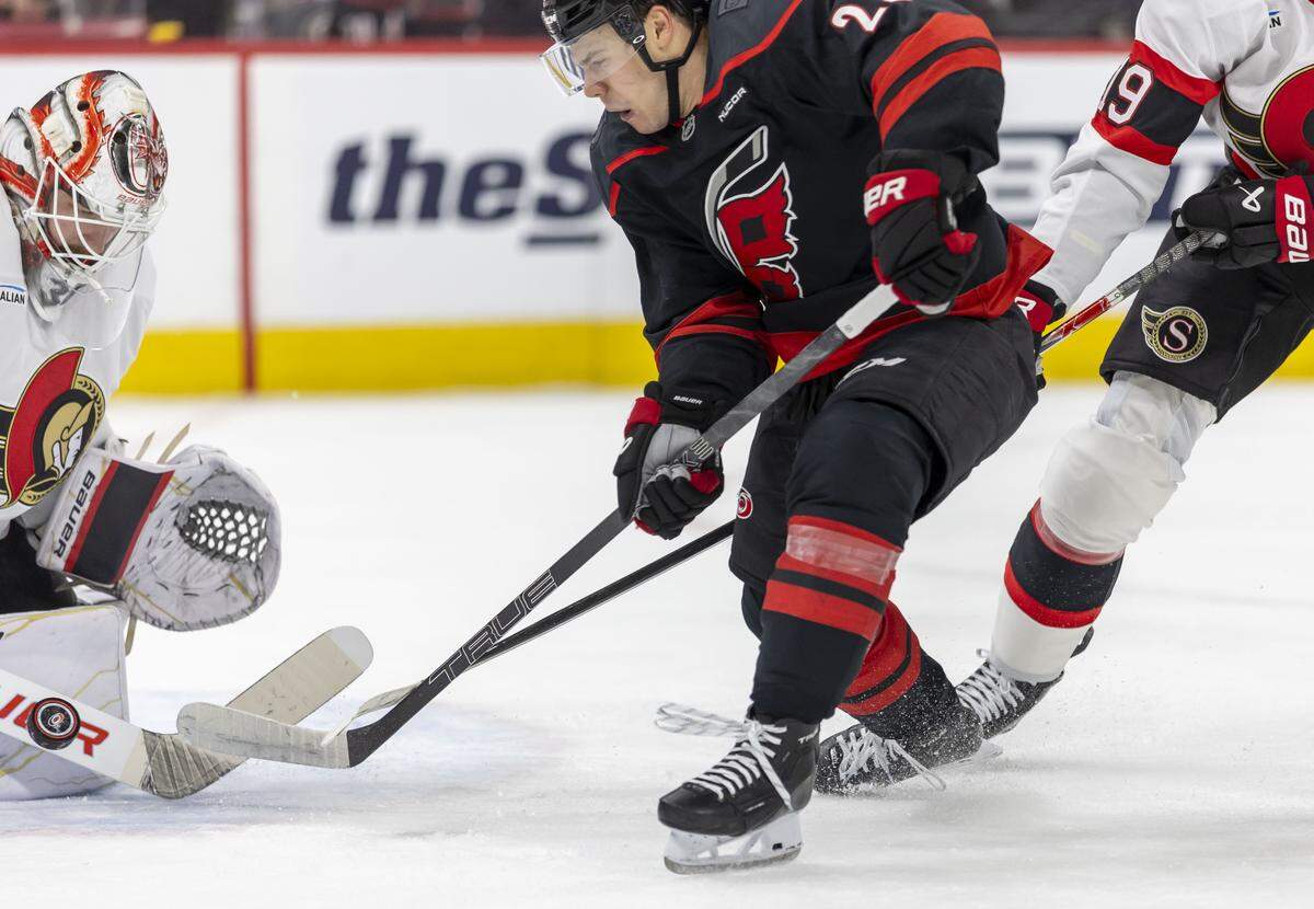 Ottawa Senators goalie Liunus Ullmark (35) stops a scoring attempt by Carolina Hurricanes center Logan Stankoven (22) in the first period on Saturday, April 18, 2026 during the first round of the Stanley Cup Playoffs at Lenovo Center in Raleigh, N.C.