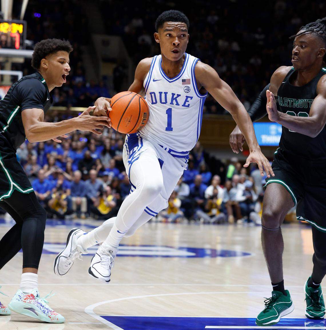 Duke’s Caleb Foster (1) drives between Dartmouth’s Jaren Johnson (5) and Jayden Williams (22) during the first half of Duke’s game against Dartmouth at Cameron Indoor Stadium in Durham, N.C., Monday, Nov. 6, 2023.